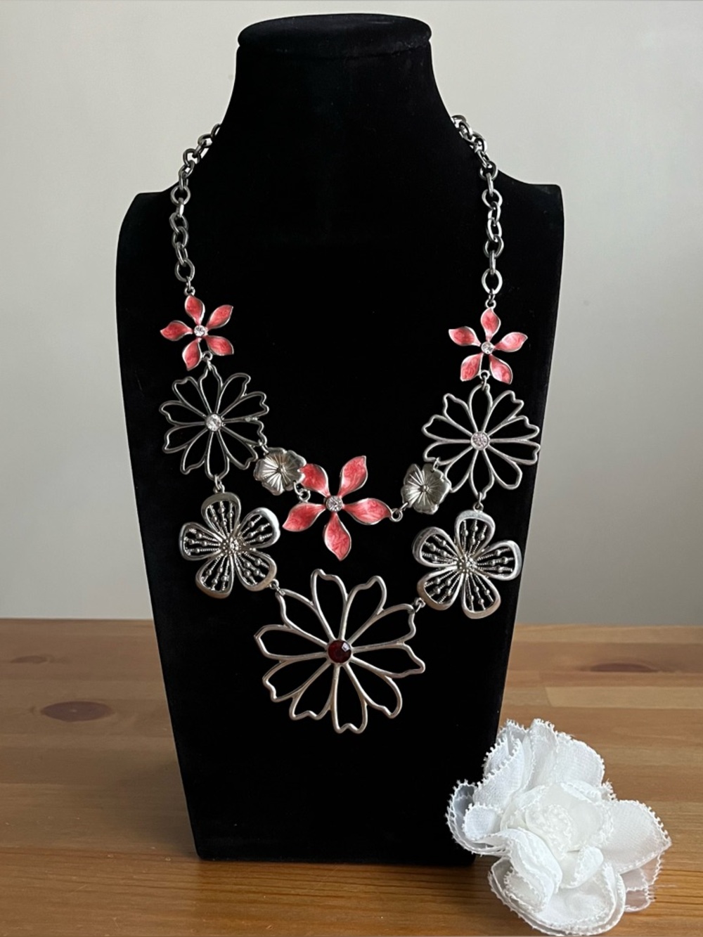 NY flower necklace with peach enamel gem petals alternating with rhinestones